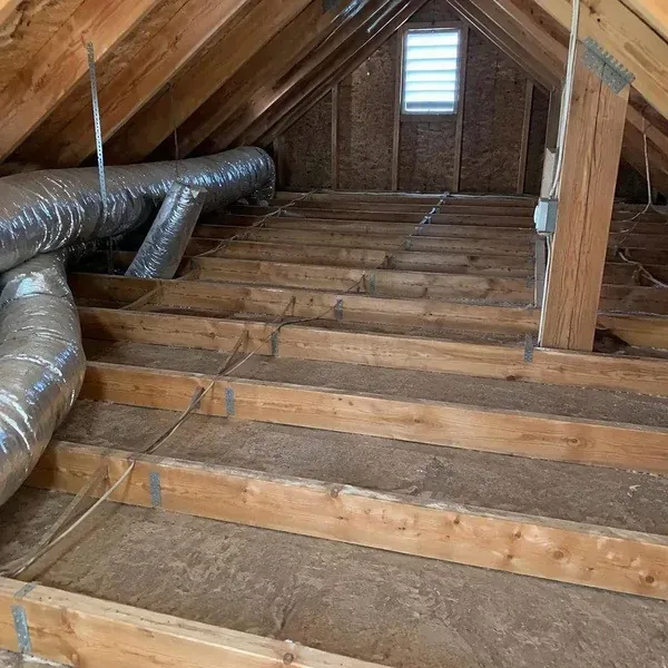 Attic floor prepared and air sealed before blown-in insulation