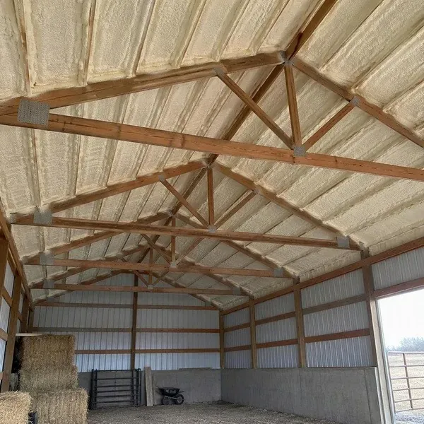 Closed cell spray foam insulation on the underside of a barn roof