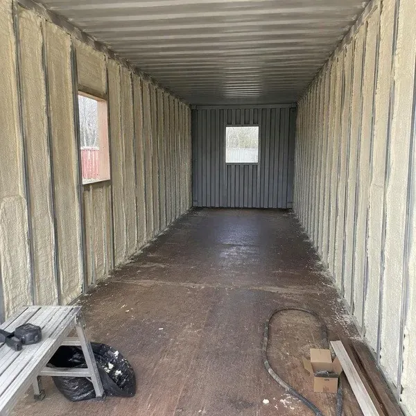 Empty shipping container prepared for spray foam insulation