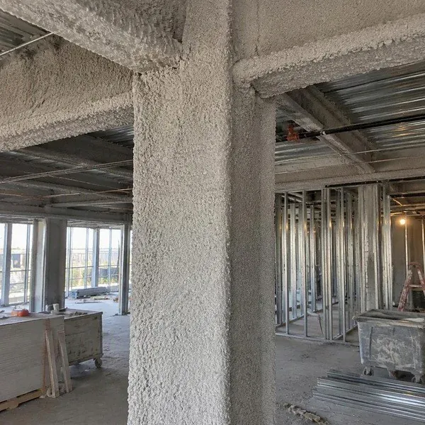 Spray applied fireproofing on an exposed structural steel column